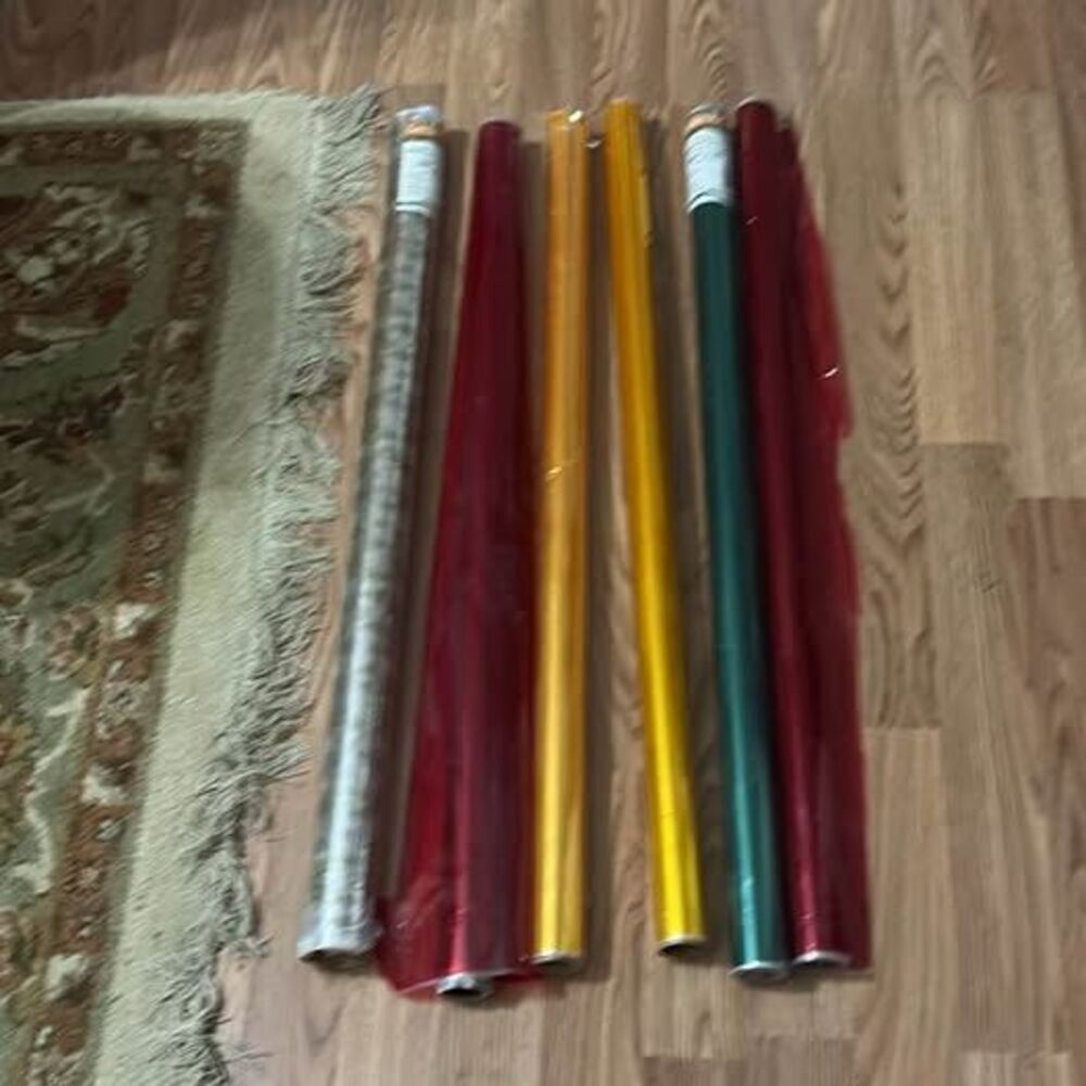 Rolls of colored holiday cellophane wrapping